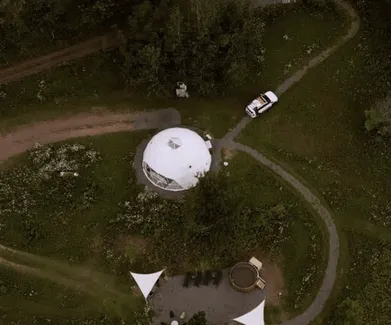 white geodesic dome from a drone view