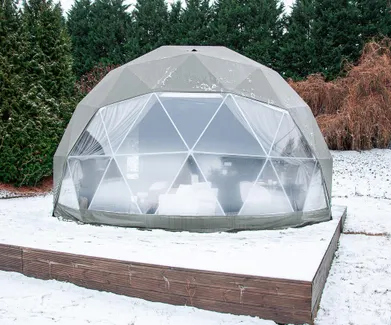 olive-colored geodesic dome with condensation