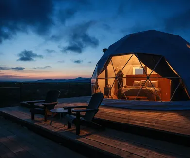 geodesic dome on wooden deck at night