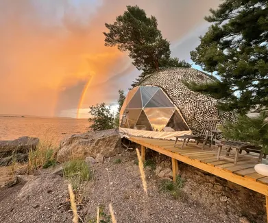 sunset view and geodesic dome on the coast of lake