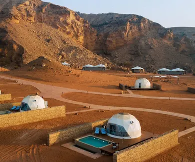 eight white geodesic domes on the desert