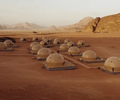 beige geodesic domes at desert