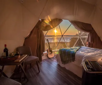 slow movement glamping dome in sunset FDomes