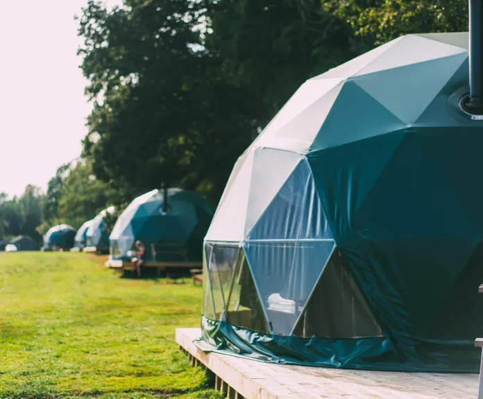 a forest green geodesic domes with stack