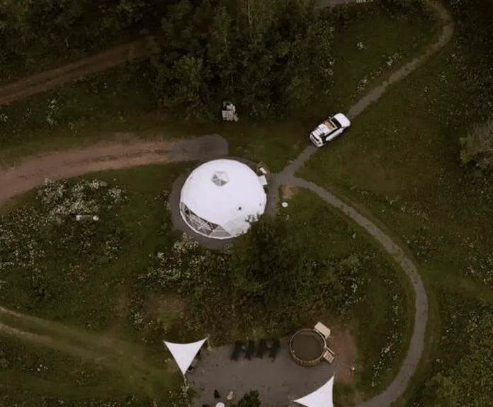 white geodesic dome from a drone view