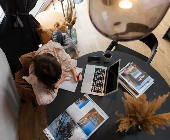 workcation woman sitting in the desk in geodesic dome powered by FDomes