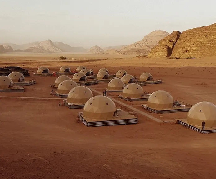 beige geodesic domes at desert