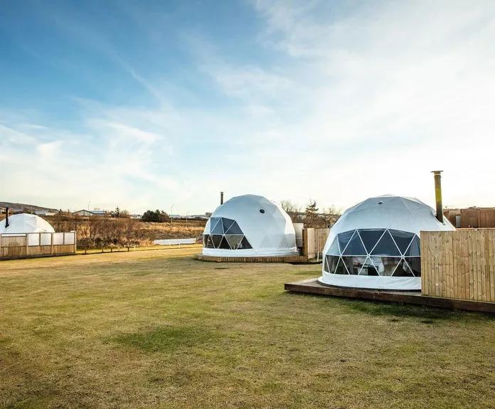 three white geodesic dome on the campsite