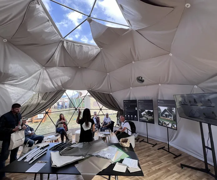 interior of geodesic dome with people while event Glamping Show Americas 2023, Colorado, USA