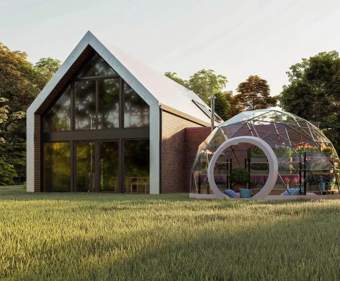 geodesic dome with a transparent membrane next to the barn