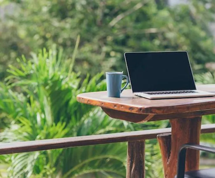 laptop on desk outside 