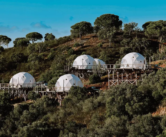 white domes on a hill in hot climate