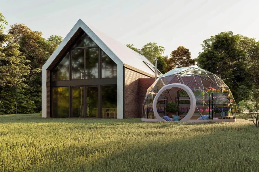 geodesic dome with a transparent membrane next to the barn