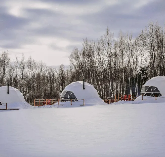 white geodesic domes in snow