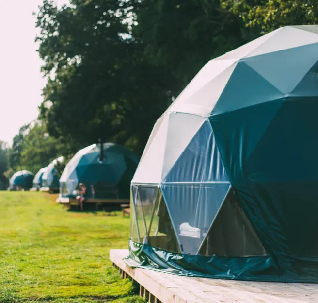 a forest green geodesic domes with stack