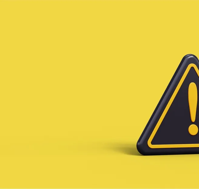 baner showing a warning sign on a yellow background