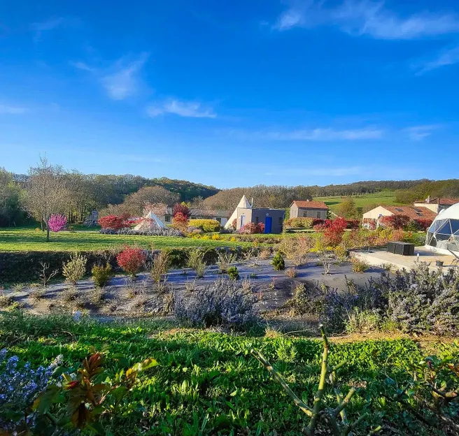 garden with some houses and a white geodesic dome