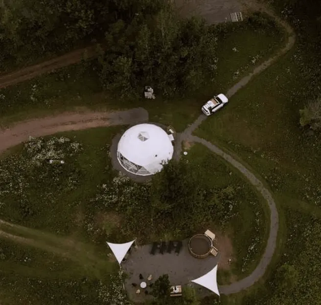 white geodesic dome from a drone view