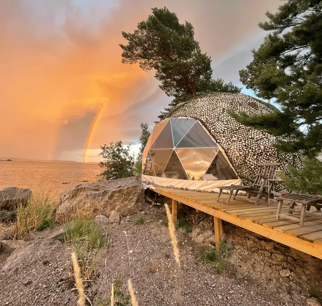 sunset view and geodesic dome on the coast of lake