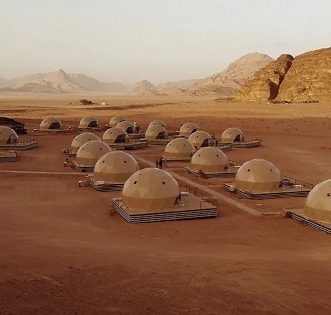 beige geodesic domes at desert