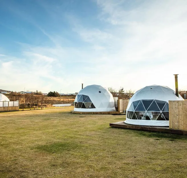 three white geodesic dome on the campsite