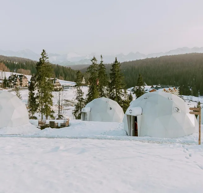 white geodesic domes in snow