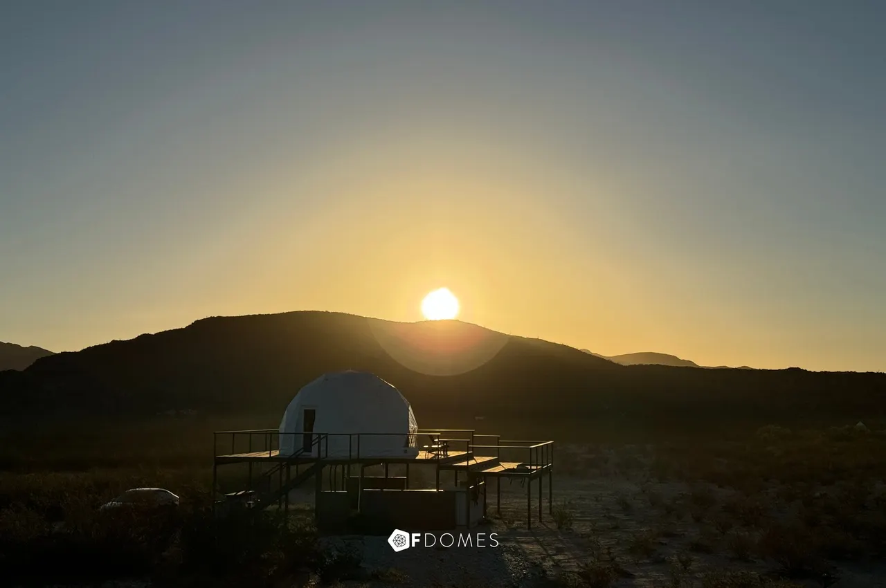 FDomes dome in a rising sun, Double Moon Ranch Terlingua, Texas, USA