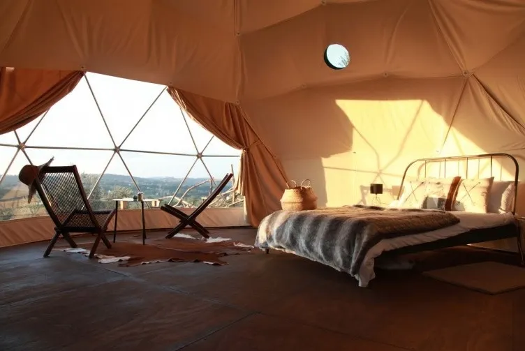 interior of geodesic dome with view at window and nature
