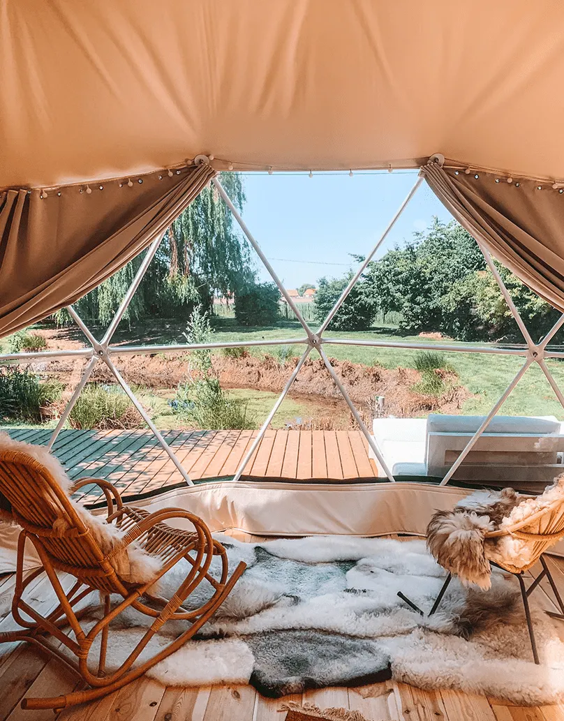 interior of geodesic dome with view at window, insulation and chairs