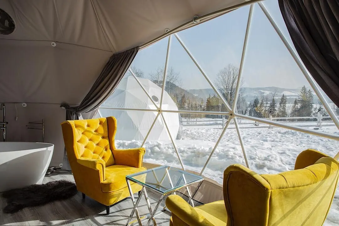 glamping dome warm interior during winter in the mountains