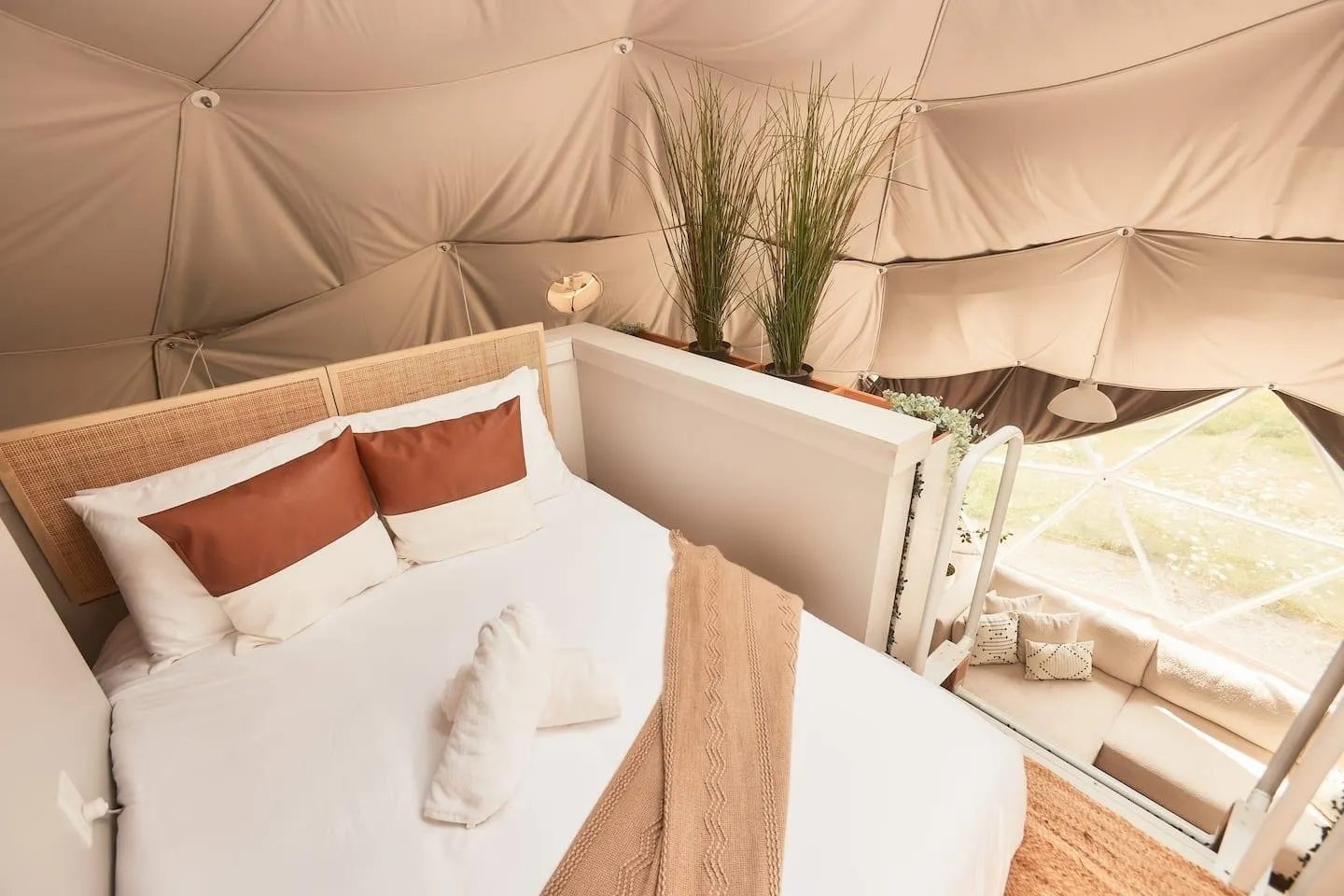 interior of geodesic dome with view of loft bed and insulation