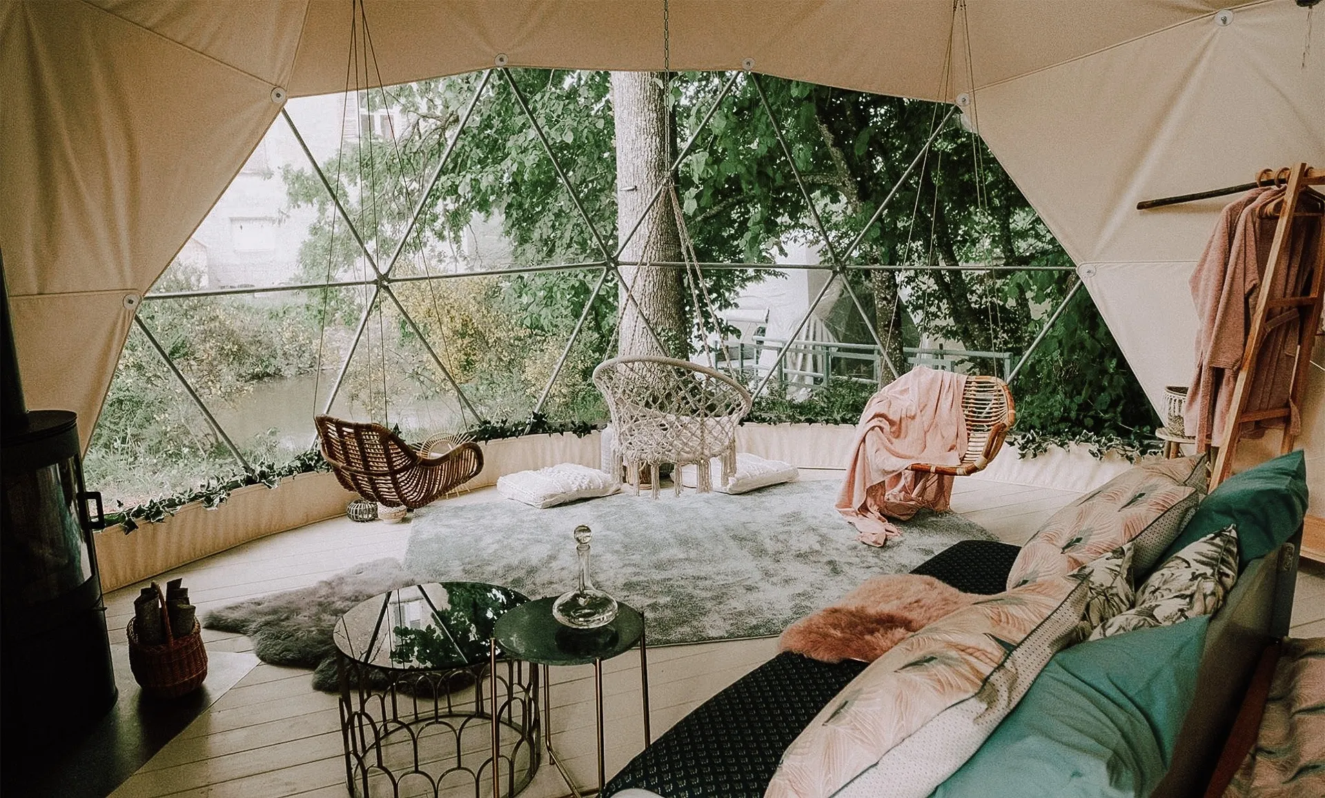 interior of geodesic dome with view at sofa, coffee table, window and insulation