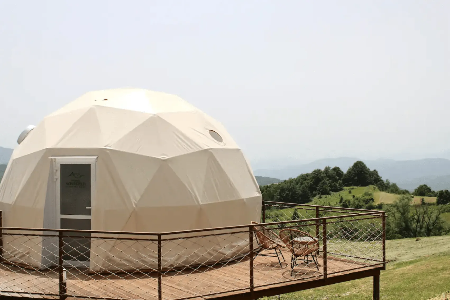 beige geodesic dome with terrace