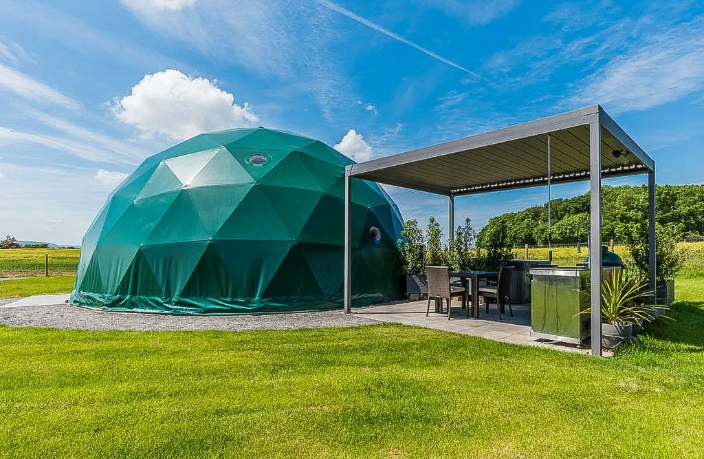 green geodesic dome on the campsite