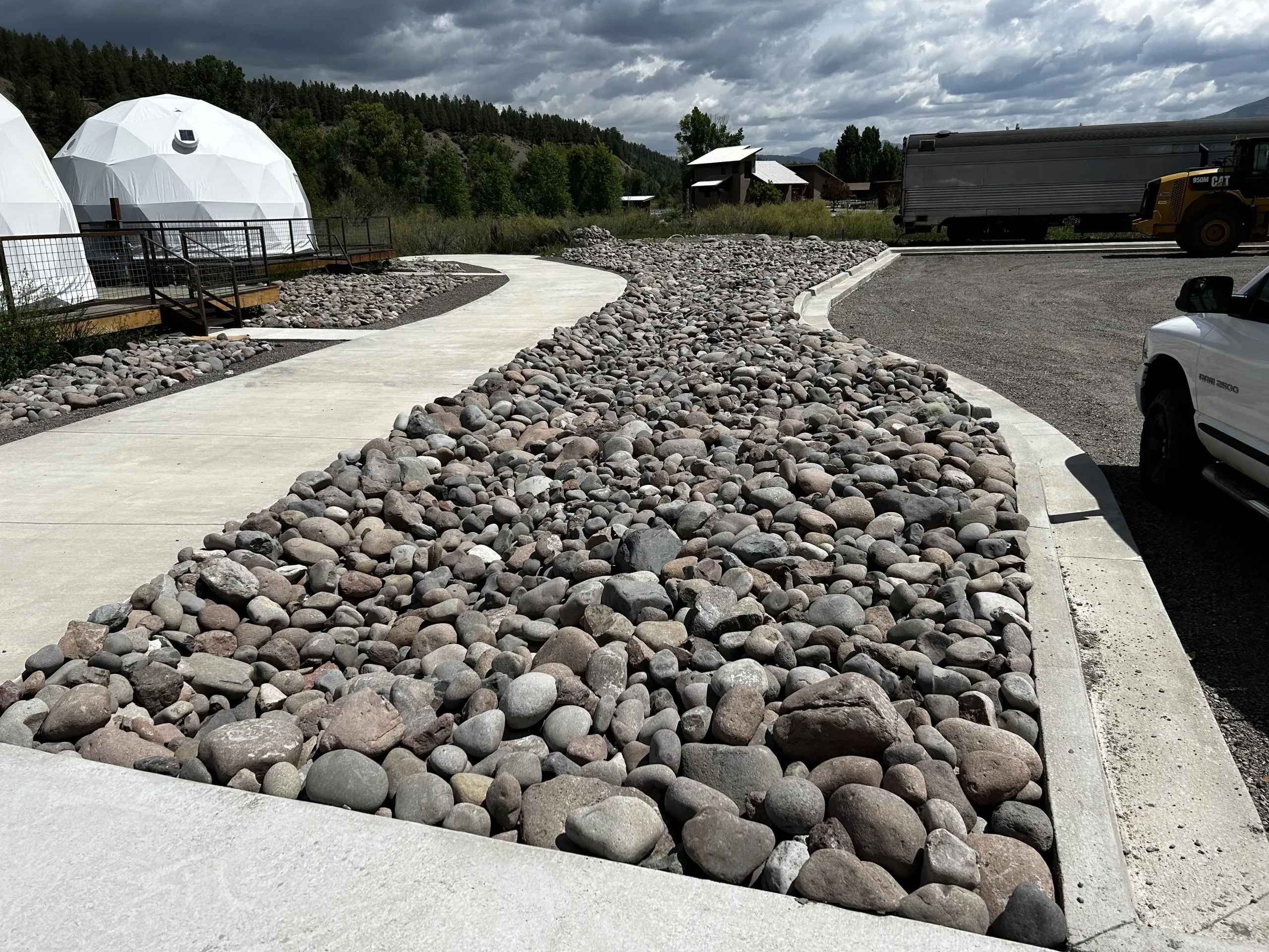 two geodesic domes on a campsite