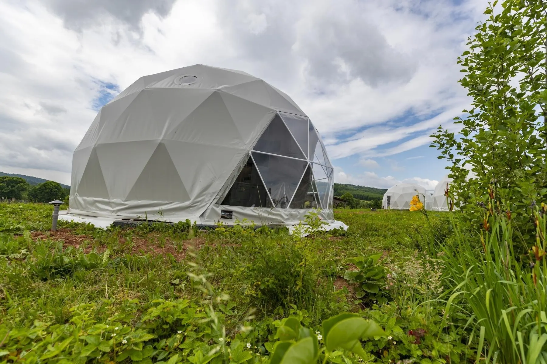 white geodesic dome on the field