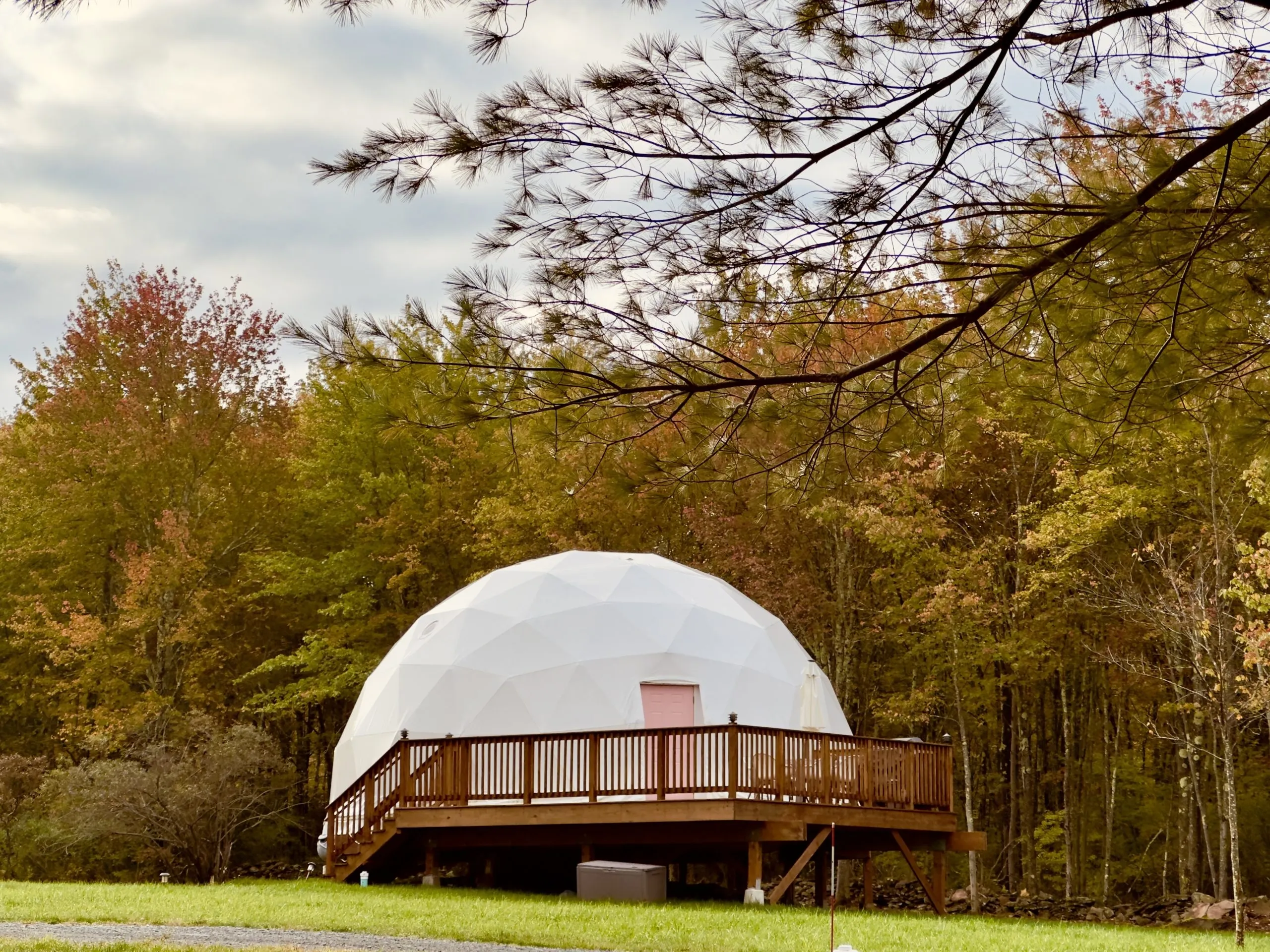 white dome cloudy sky woods Unique Escapes