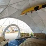 interior of dome tent with view at window and table bench