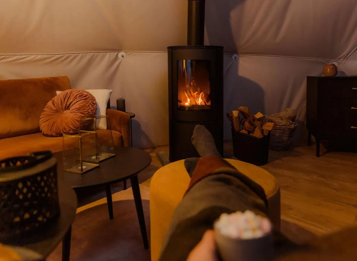 chilling near fireplace in geodesic dome 