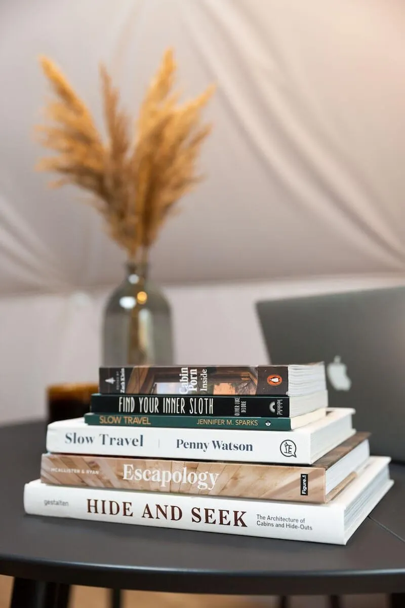 pile of books on table in geodesic dome