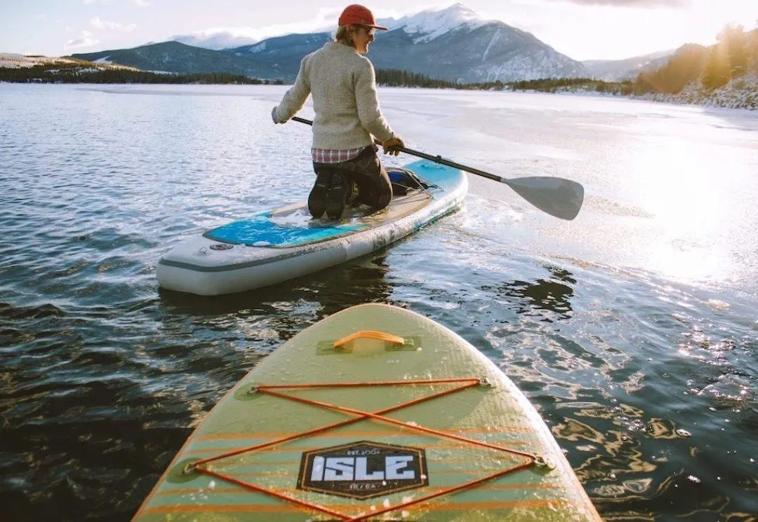 Launching a Glamping Resort Checklist (Part 2) male on paddle board 